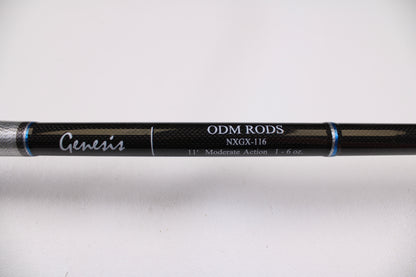 Close-up of the ODM Rods Genesis Surf NGX-116 11'0" 2 Piece used spinning rod in excellent condition. Black shaft shows "11', Moderate Action, 1-6 oz." Ideal for upgrading through our rod and reel trade-in program. Plain white background.