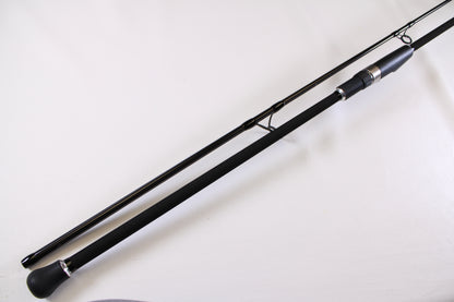 A close-up of the ODM Rods Genesis Surf NGX-9635 9'6" Used Spinning Rod in excellent condition, showing its padded handle and metal reel seat—great for those looking to upgrade or trade in their gear for store credit.