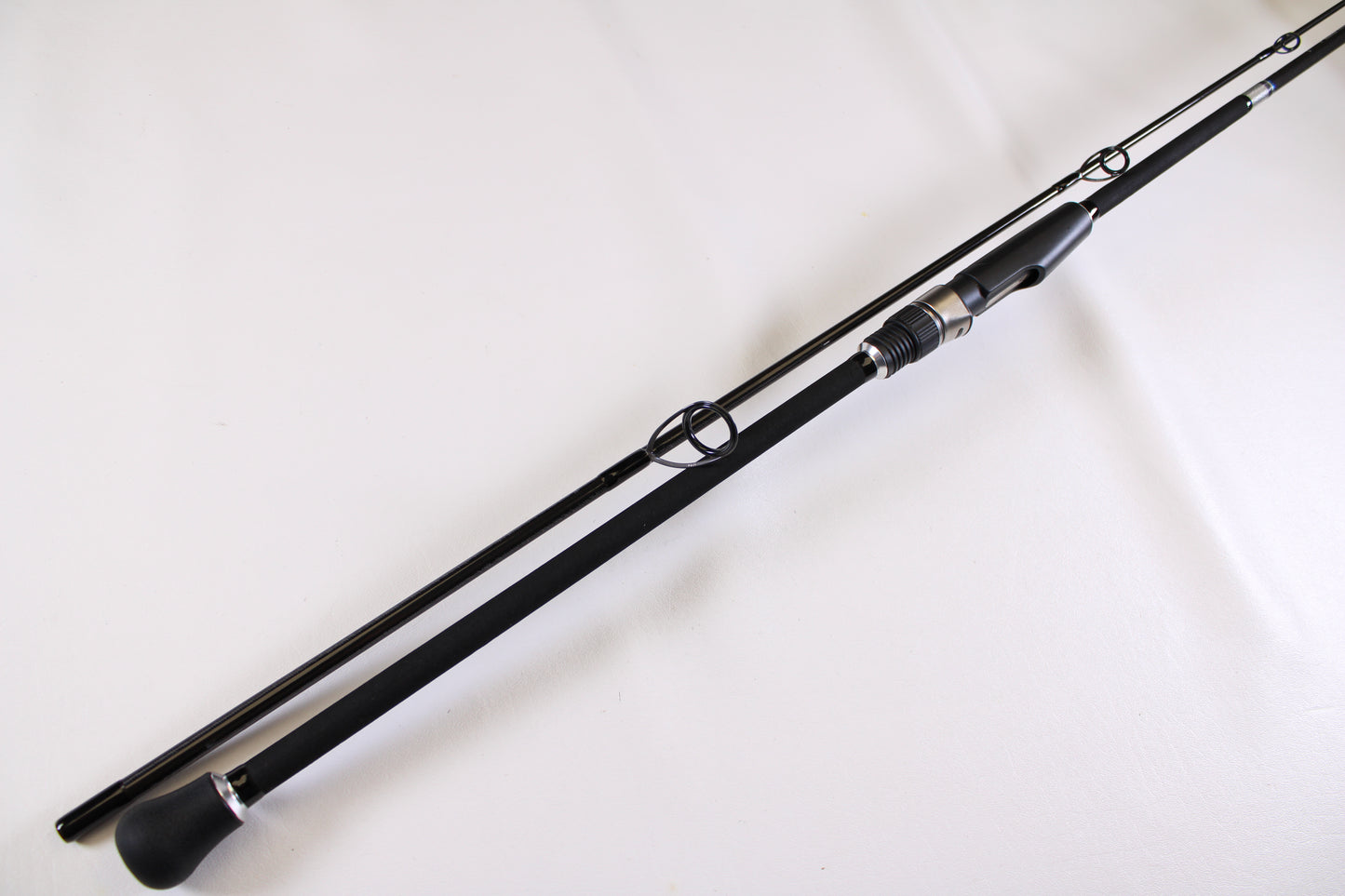 The ODM Rods Genesis Surf NGX-802 8'0" 2 Piece Used Spinning Rod in excellent condition is shown unassembled. Trade in your used gear through our Rod and Reel Trade-In Program for store credit on your next purchase.