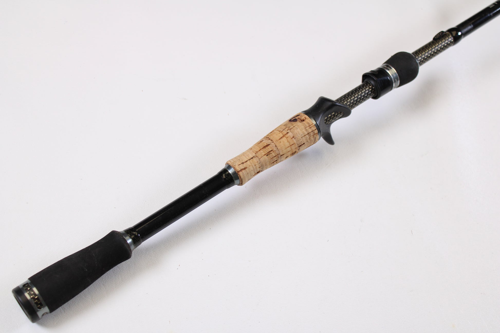 A close-up of the 13 Fishing Envy Black EBC76H 7'6" Heavy Used Casting Rod in very good condition—ideal for anyone interested in trading in or upgrading gear through our Rod and Reel Trade-In Program.