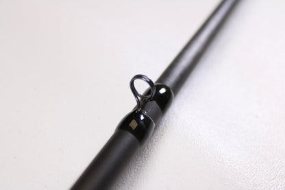 Close-up of a 13 Fishing Envy Black EBC76H 7'6" Heavy used casting rod in very good condition, highlighting the line guide—an ideal choice for our Rod and Reel Trade-In Program.