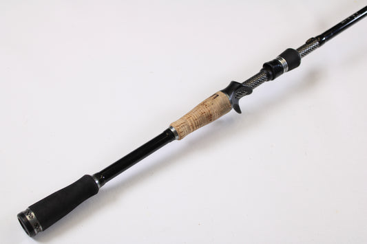 A close-up of the 13 Fishing Envy Black EBC711H 7'11" Heavy Used Casting Rod in very good condition—ideal for those looking to upgrade gear through our rod and reel trade-in program for store credit.