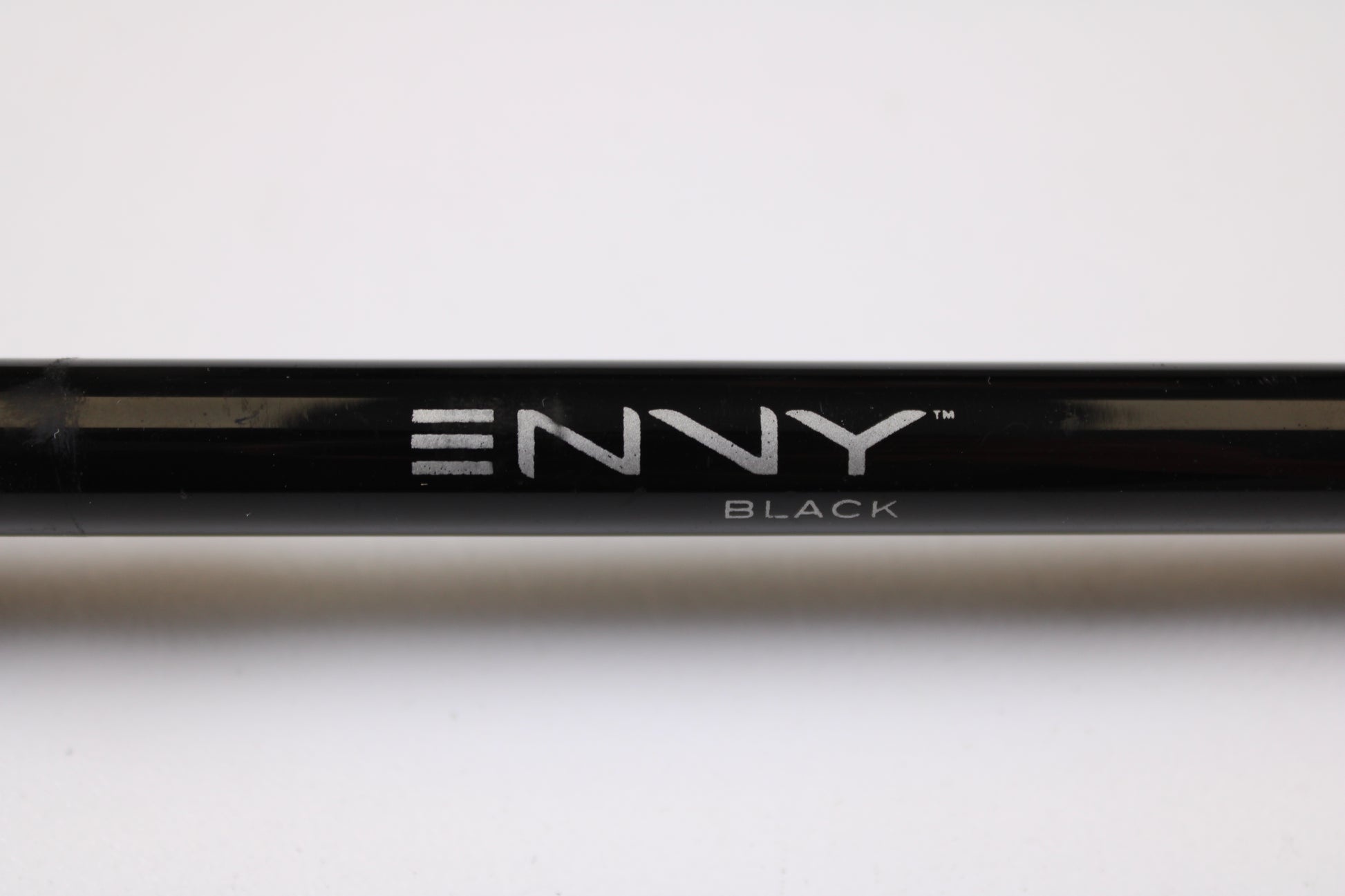 A close-up of a 13 Fishing Envy Black EBC711H 7'11" Heavy used casting rod in very good condition, featuring "ENVY" in silver letters and "BLACK" beneath, set against a plain white background—ideal for detailing trade-in or store credit offers.