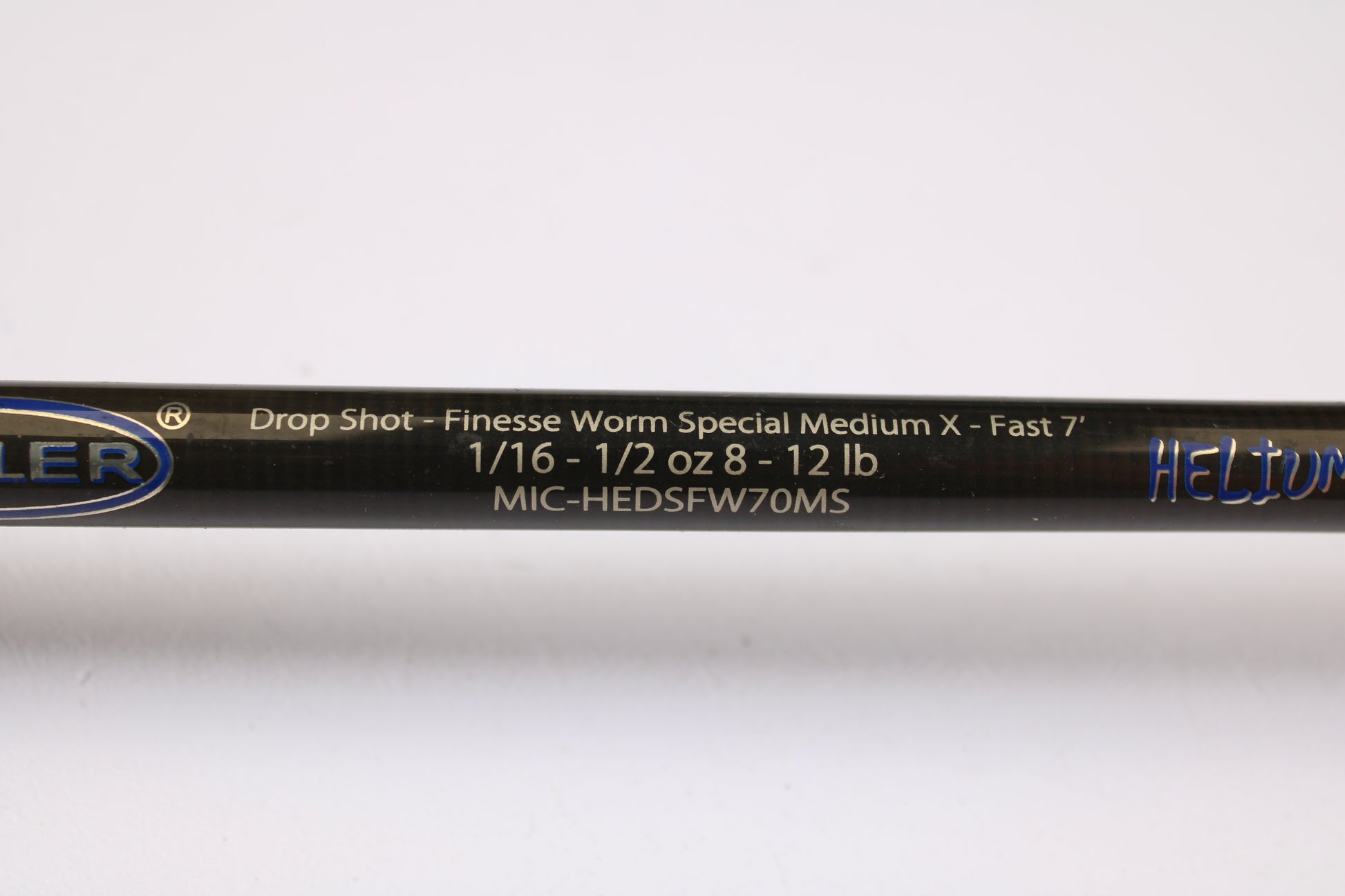 A close-up of a Kistler Helium LTA MIC-HEDSFW70MS 7'0" Medium used spinning rod in very good condition. Eligible for our Rod and Reel Trade-In Program—trade in your used gear for store credit.