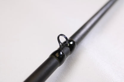 Close-up of a 13 Fishing Envy Black EBC71H 7'1" Heavy Used Casting Rod in very good condition, showing its metal guide ring—ideal for trading in used gear for store credit with our Rod and Reel Trade-In Program.