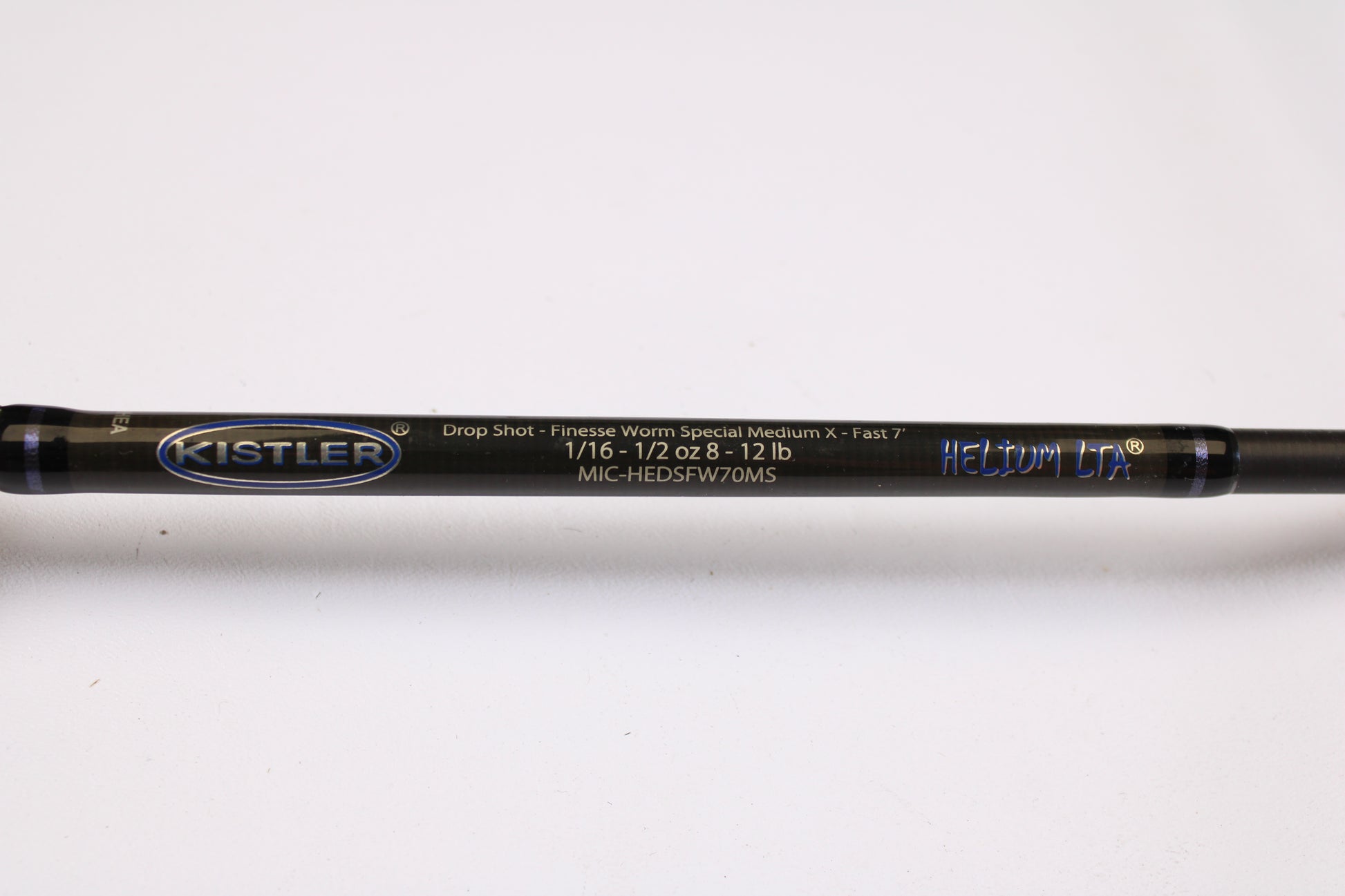 A close-up of the Kistler Helium LTA MIC-HEDSFW70MS 7'0" Medium Used Spinning Rod in very good condition, featuring model details—ideal for the Rod and Reel Trade-In Program.