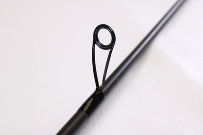 Close-up of the Kistler Helium LTA MIC-HEDSFW70MS 7'0" Medium Used Spinning Rod in very good condition, showing its guide—eligible for trade-in through our Rod and Reel Trade-In Program for store credit.