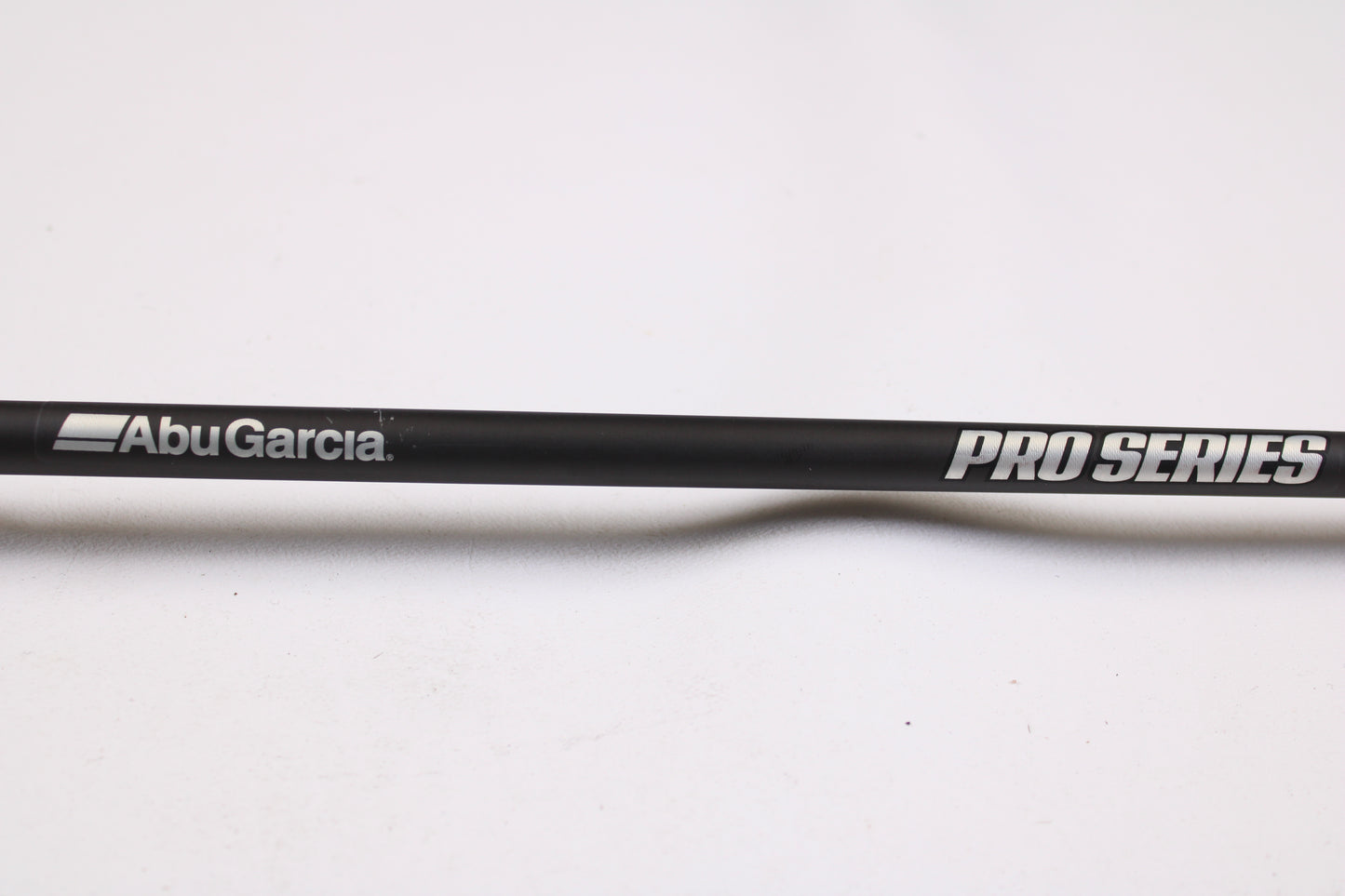 A close-up of the Abu Garcia Pro Series PSJCC76-6 John Cox Shallow Crankbait 7'6" Medium Heavy Used Casting Rod in excellent condition, ideal for upgrading via our Trade-In Program or shopping quality used gear, set on a plain white background.