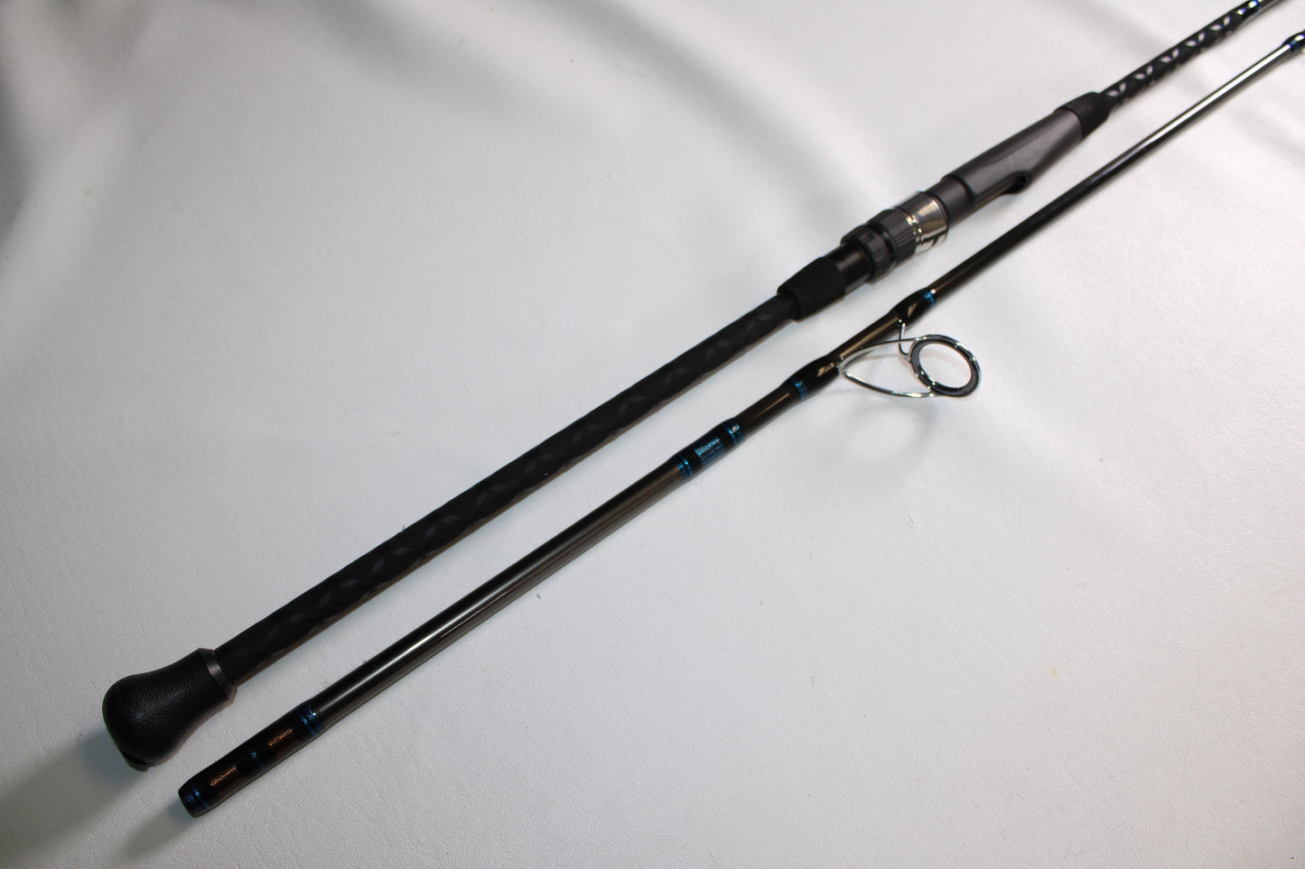 The Tsunami Air Wave Elite TSAWESS802LT 8'0" 2-piece used spinning rod, in excellent condition, is perfect for those upgrading through our Rod and Reel Trade-In Program or earning store credit for used gear.
