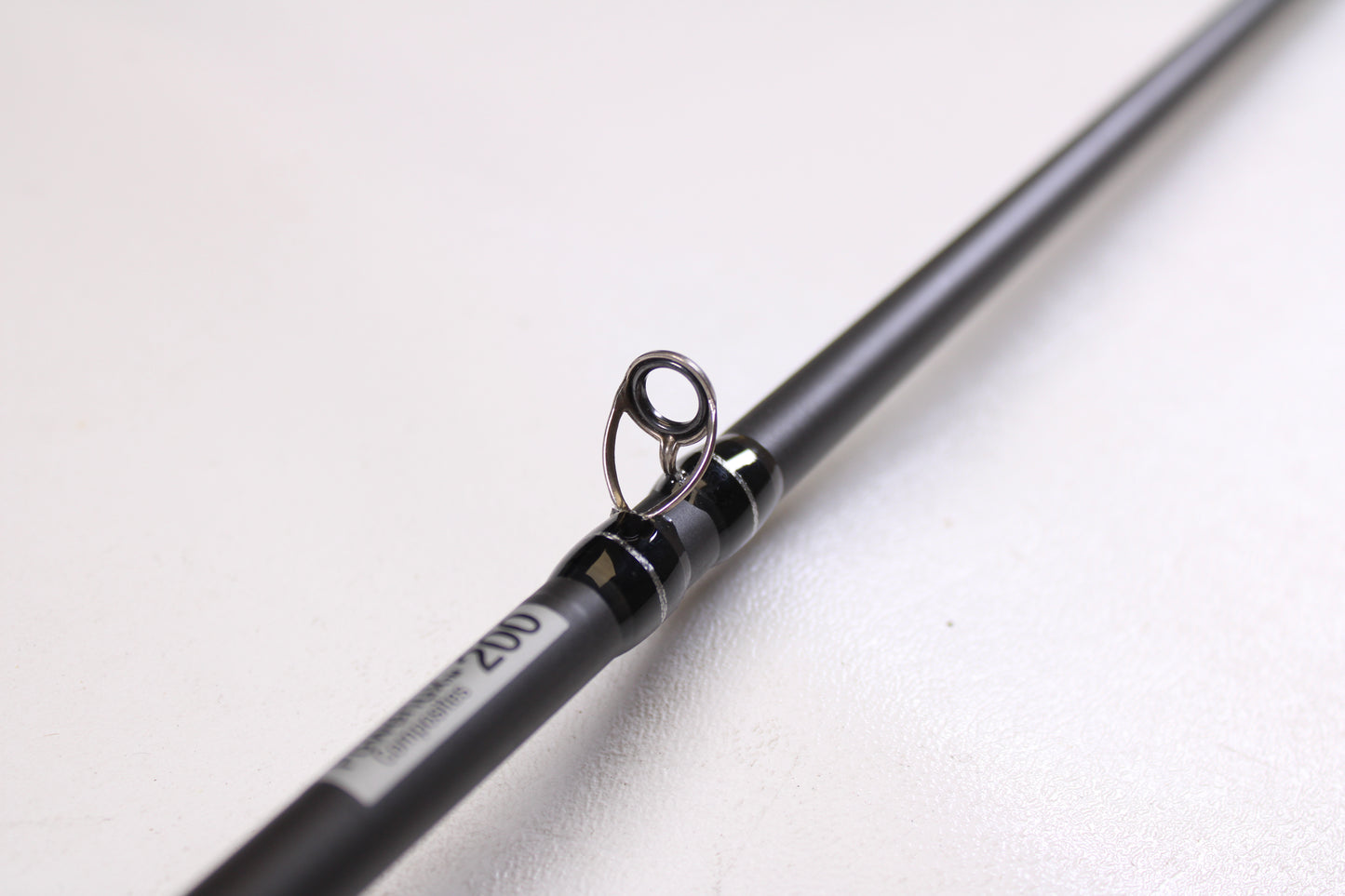 A close-up of the Abu Garcia Pro Series PSJCC76-6 John Cox Shallow Crankbait 7'6" Medium Heavy Used Casting Rod in excellent condition—ideal for anyone seeking quality used gear from Abu Garcia.
