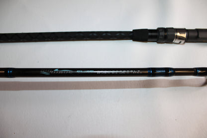 A close-up of the Tsunami Air Wave Elite TSAWESS802LT 8'0" 2-piece used spinning rod in excellent condition, showcasing its handle and model details—ideal for those interested in quality pre-owned Tsunami rods.