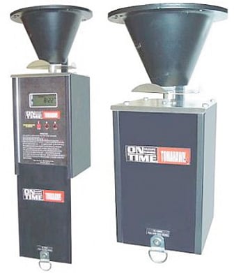 Two black On Time Game Feeder units with Tomahawk Vl Timer Only are shown side by side—one front, one side view. Features include a funnel-shaped top, digital display, Universal Mounting System, and On Time branding.