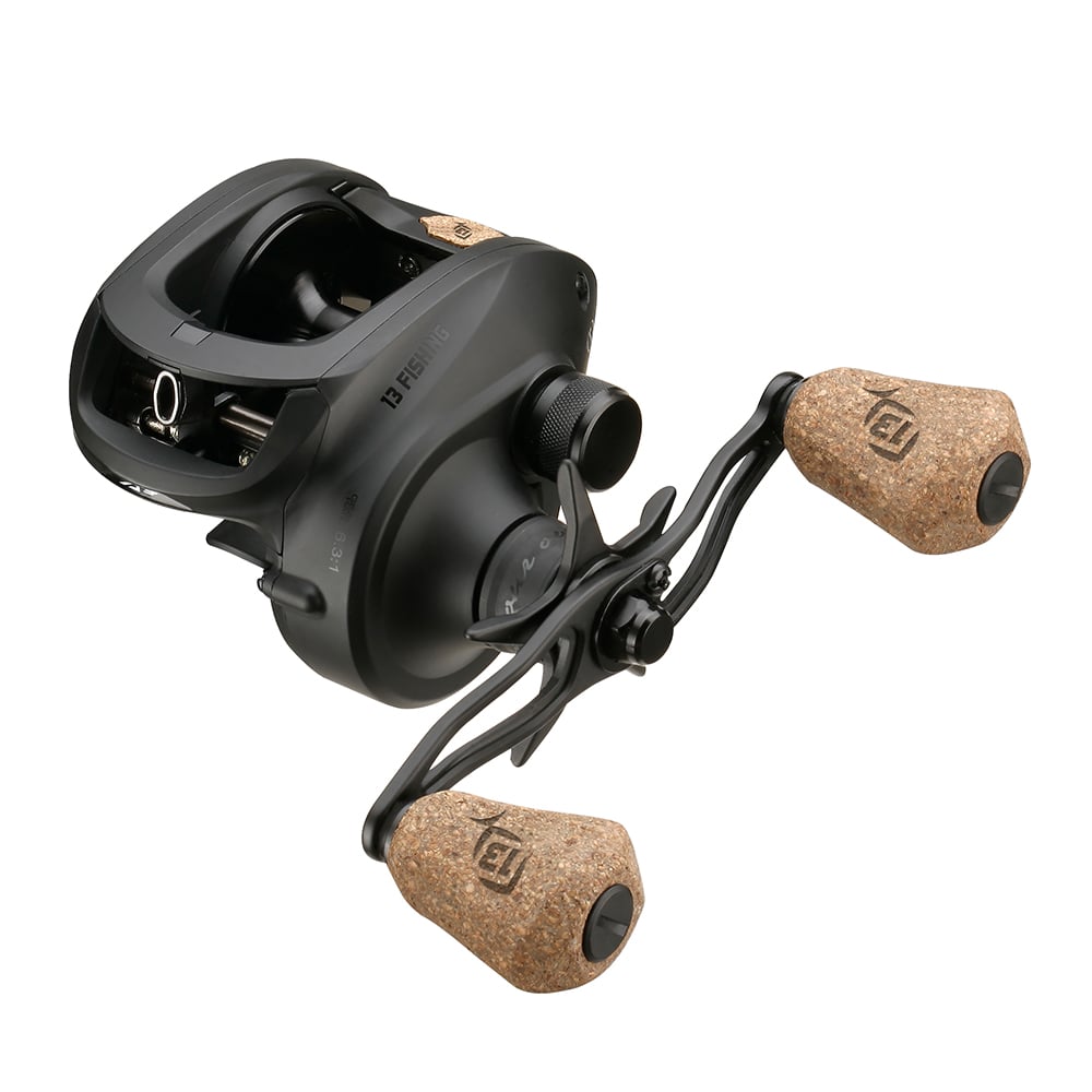 The 13 Fishing Concept A3 Gen II Casting Reel Left Hand 6.3:1 (CA3-6.3-LH) by 13 Fishing features a matte black finish and two cork handle grips, ideal for saltwater fishing, displayed against a white background.