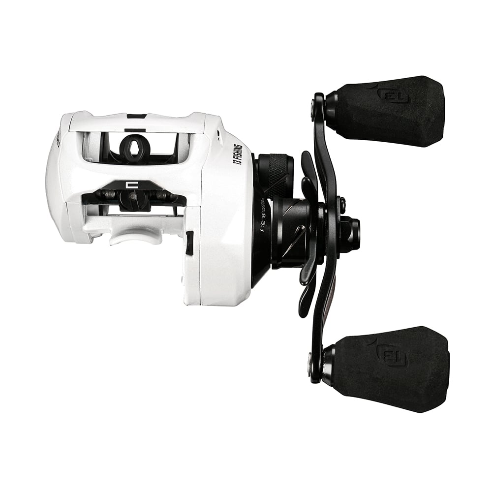 The 13 Fishing Concept C2 Casting Reel Left Hand 8.3:1 (C2-8.3-LH) by 13 Fishing is shown in white with two black padded handles, designed for left hand retrieve, viewed from the side on a plain white background.