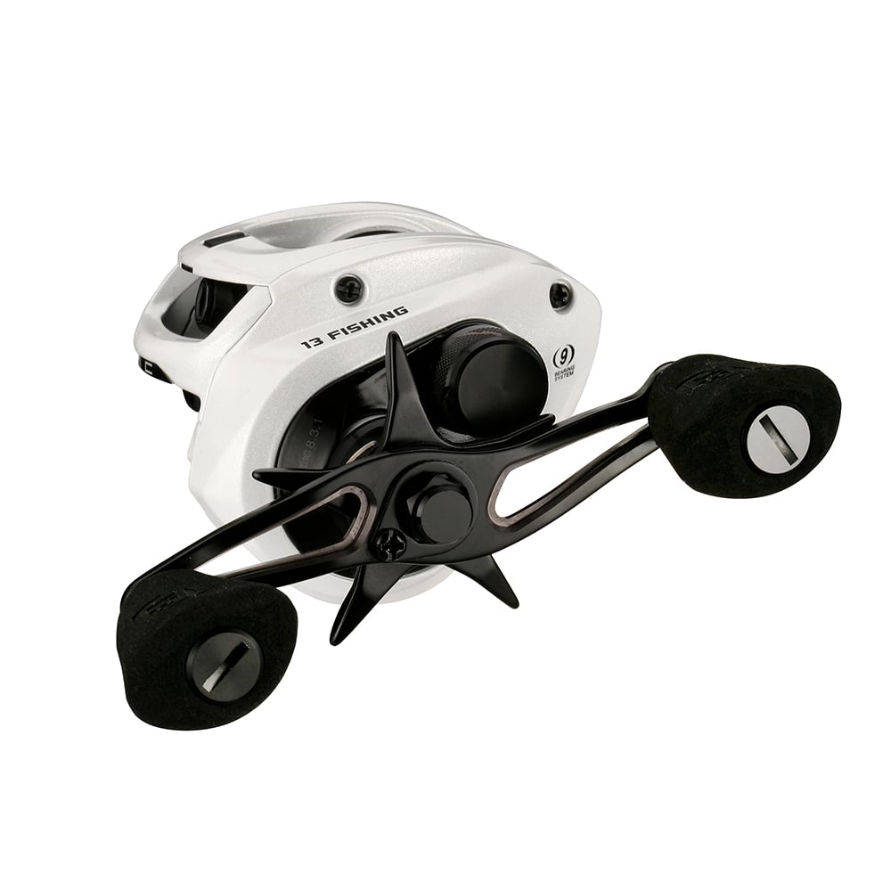 The 13 Fishing Concept C2 Casting Reel Left Hand 6.8:1 (C2-6.8-LH) features a white body, black handles and spool, foam grips, compact modern design, and is labeled "13 FISHING" for stylish left-handed casting.