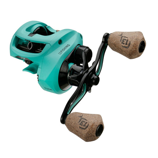 The 13 Fishing Concept TX2 Casting Reel Left Hand 7.5:1 (TX2-7.5-LH) features a teal finish, dual cork handles, and black metal accents, shown against a white background. Brand: 13 Fishing.