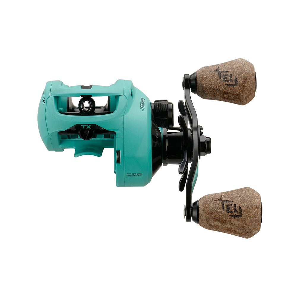 A teal 13 Fishing Concept TX2 Casting Reel Left Hand 7.5:1 (TX2-7.5-LH) with cork grip handles and black components, displayed on a white background.