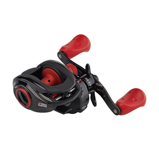 The Abu Garcia Max X Casting Reel 6.4:1 Left Hand (MAX4X-L) features a black and red compact design, two large red grips, "Abu Garcia" branding, and durable Duragear Brass gear for long-lasting performance.