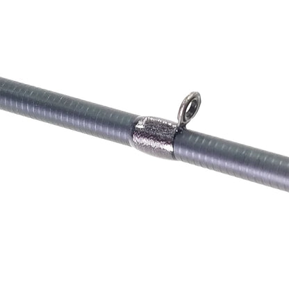 A close-up of the ALX ENOX Casting Rod Decoy 7'1" Medium Heavy (E28540FC) features a guide ring attached to the rod, highlighted by a textured spiral pattern for style and metallic thread wrapping for durability. Ideal for tournament anglers, set against a plain white background.