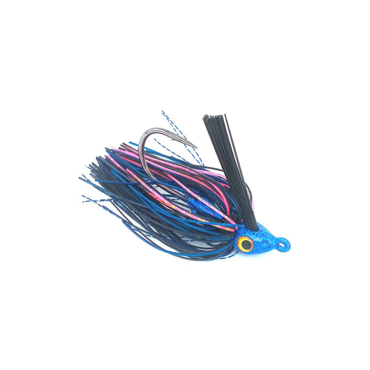 The Beast Coast Zero Flex Gorilla Swim Jig V1 7/16oz. Cajun Crush features blue, purple, and black skirt strands, a large hook, bright yellow eyes, and a weed guard, shown isolated on a white background.