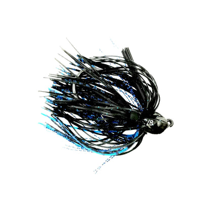 The Beast Coast Lil' Magnum Compact Flipping Tungsten Jig showcases a black and blue design with shiny fibers, mimicking bait. Its weight-forward style includes fibers fanning out from a tungsten head and an optimized weed guard. Isolated on white, it highlights its sleek profile and metal hook.