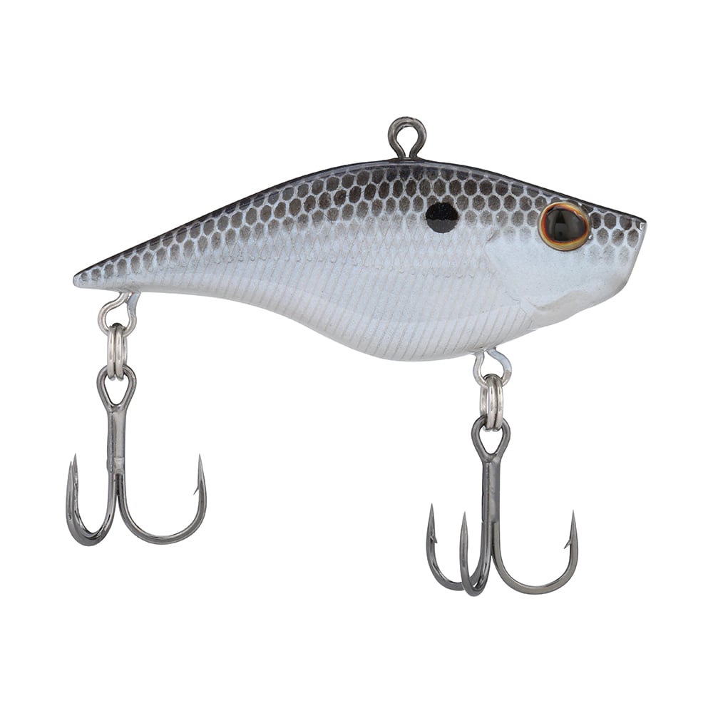 The Berkley Warpig Jr. Lipless Crankbait by Berkley is a realistic fish-shaped, silver-bodied sinking bait with black scales. It boasts an aggressive action, loud sound, two treble hooks on the belly and tail, and a single eye with a dark pupil.