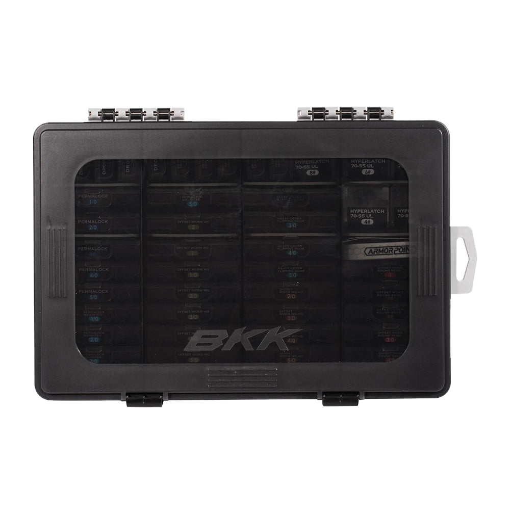 The BKK OCD Tackle Storage System Fully Loaded (D-ST-01011) is a black waterproof box with a transparent lid, two latches, and a right-side handle tab. "BKK" is printed on the lid, showcasing neatly organized contents for optimal tackle storage.