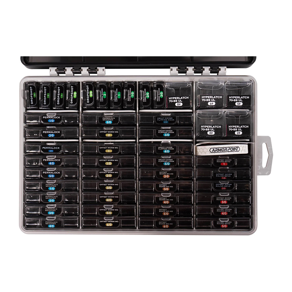 The BKK OCD Tackle Storage System Fully Loaded (D-ST-01011) by BKK is a transparent plastic waterproof box with a handle, featuring multiple compartments to neatly organize black fuses or circuit breakers.