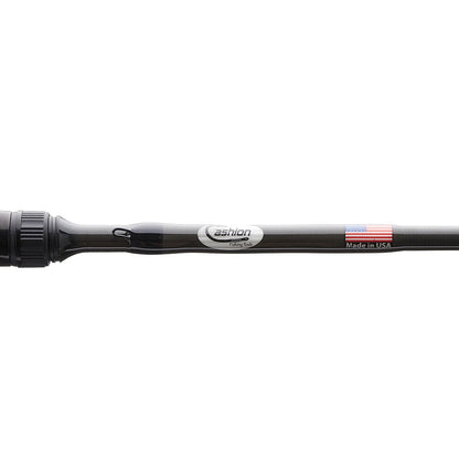 Close-up of a Cashion CORE Series Casting Rod Cranking 7'0" Medium Heavy (CC8457) by Cashion. Features a "Made in USA" label, American flag sticker, and silver "Cashion" text on the black rod.