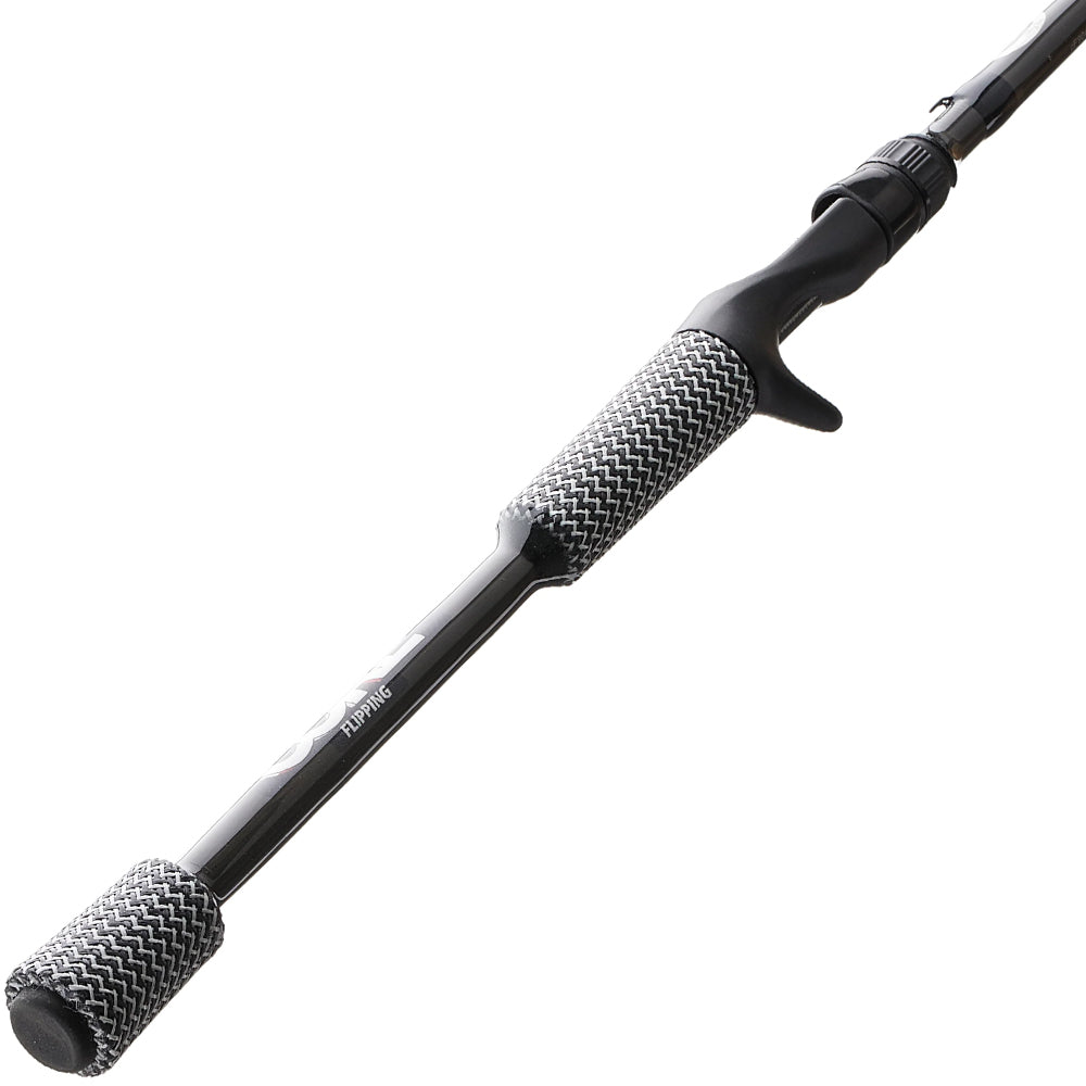 A close-up of the Cashion Rods CORE Series Casting Rod Heavy Flipping 7'6" Heavy (CFG90676) by Cashion, designed for bass fishing, with textured gray and black grips and a trigger-style reel seat on a white background.