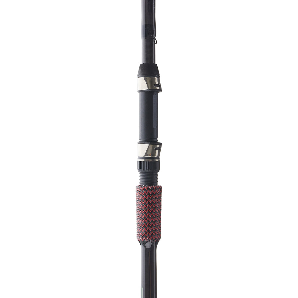 Close-up of the Cashion John Crews ICON Series Micro Jig 7'1" Medium Heavy Spinning Rod handle, featuring black and silver metal accents with a textured red and black grip. The photo displays the middle section of the rod held upright.