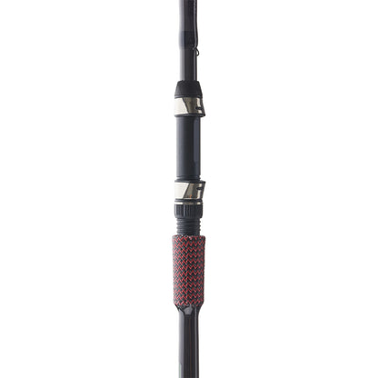 Close-up of the Cashion John Crews ICON Series Micro Jig 7'1" Medium Heavy Spinning Rod handle, featuring black and silver metal accents with a textured red and black grip. The photo displays the middle section of the rod held upright.