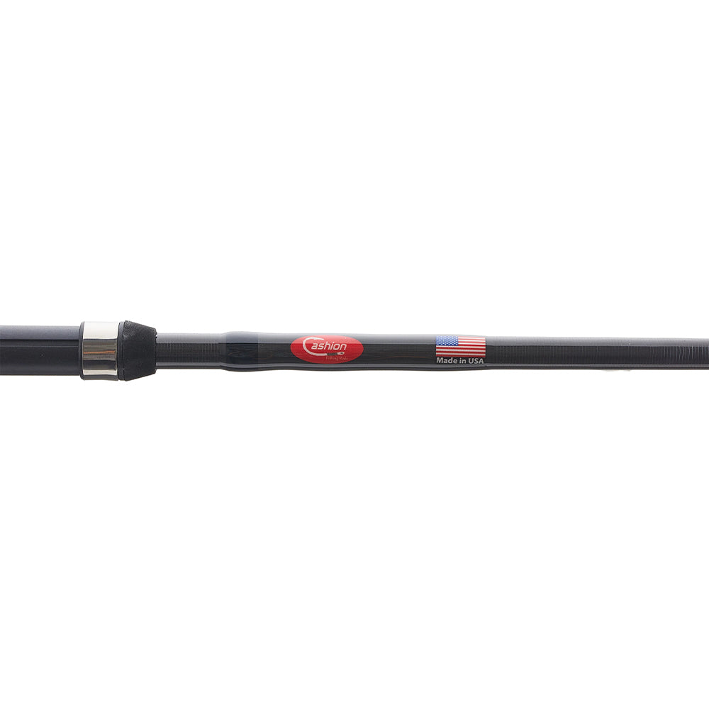 A close-up of a black Cashion Rods John Crews ICON Series SpinBait 7'6" Medium spinning rod with a red logo and "Made in USA" beside a small American flag on it, set against a white background.