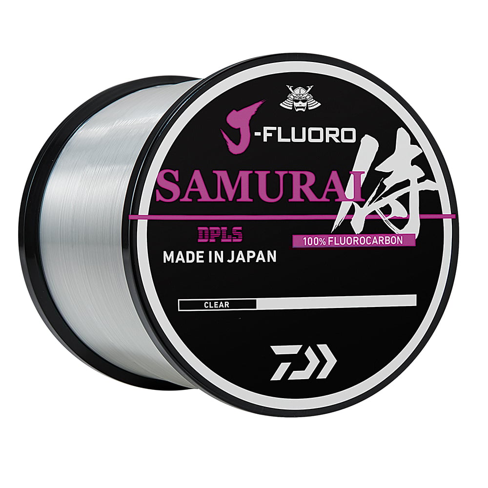 The Daiwa J-Fluoro Samurai FC Fluorocarbon Line 1000yd, designed to enhance angler performance, features "Made in Japan" and "100% Fluorocarbon" in purple and white text on a black background. This clear cylindrical line displays a logo at the top, ensuring unmatched fishability.