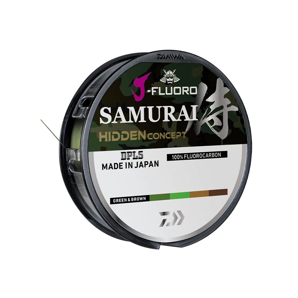 The Daiwa J Fluoro Samurai Hidden Concept 220yd fishing line, labeled as 100% abrasion-resistant fluorocarbon, is made in Japan. The label displays green and brown colors with the Daiwa brand logo above the text.