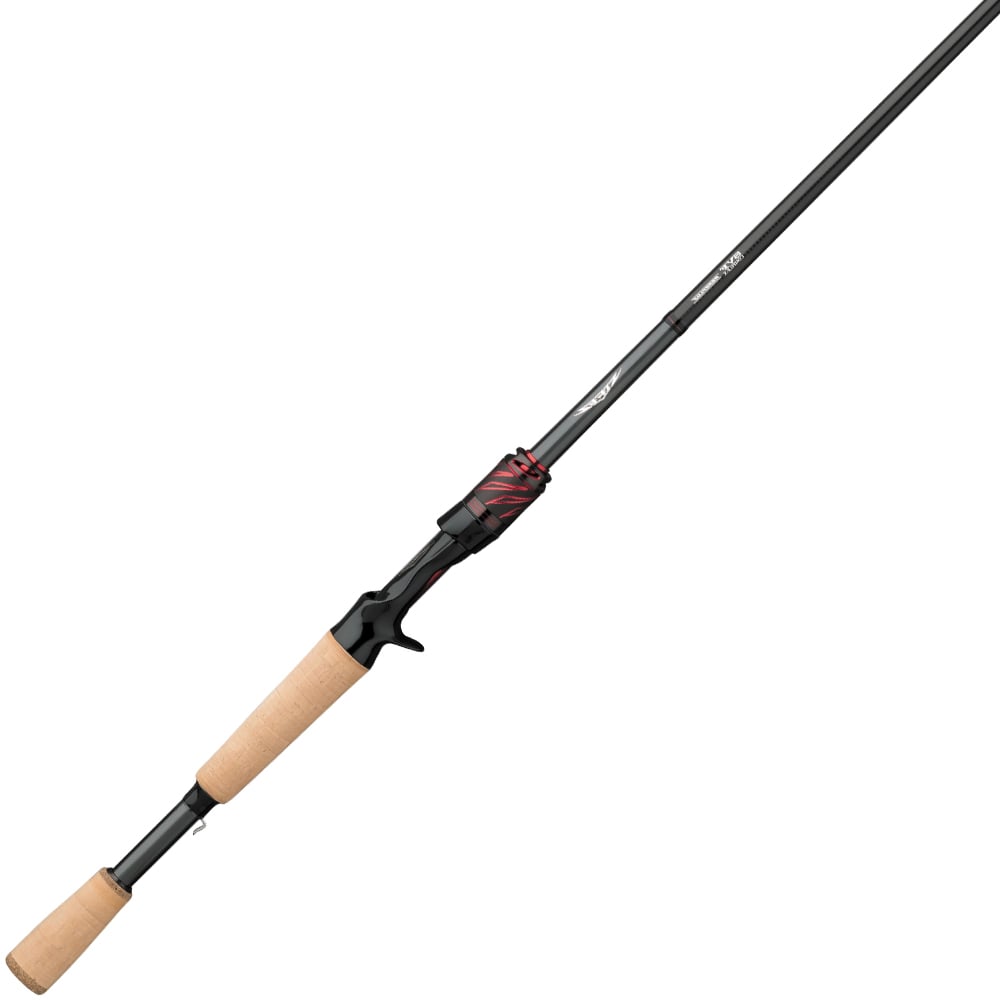 The Daiwa Steez AGS Casting Rod Universal Power 7'9" Heavy features a sleek black design, brown cork handles, and a striking red accent near the reel seat. Crafted from SVF Compile X material, it stands out against a white background.