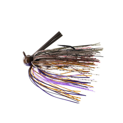 The Dirty Jigs Tour Level Skirted Football Jig by Dirty Jigs features a brown head, weed guard, and a multicolored skirt in purple, gold, brown, and gray—ideal for bass fishing—shown on a white background.