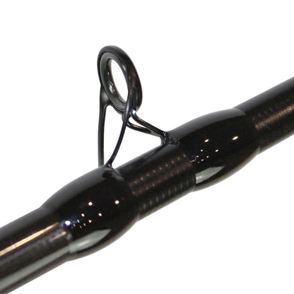 Close-up of a Dobyns Maverick Series MK 703C casting rod's black guide. The glossy finish and visible threads secure the circular metallic guide for line direction. Made from graphite blanks, this 7'0" medium heavy rod ensures precise, powerful casts.