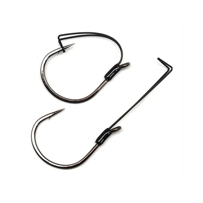 Two Gamakatsu Finesse Weedless Wide Gap Hooks are displayed; one from the side and one from the top, showcasing their curved shapes and sharp points. With a wide gap design and dark metallic finishes, these expertly crafted hooks by Gamakatsu are perfect for catching fish.