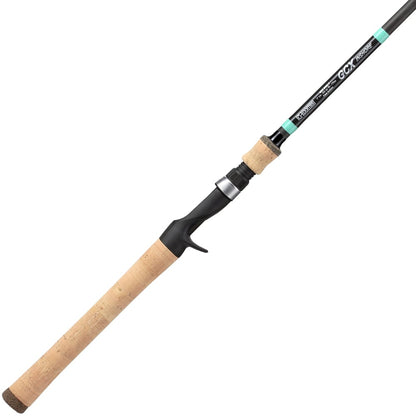The G. Loomis GCX Inshore Casting Rod 843C F 7'0" Medium Heavy features a cork handle, black reel seat, and slim black rod with blue and white accents—ideal for saltwater anglers seeking reliability.