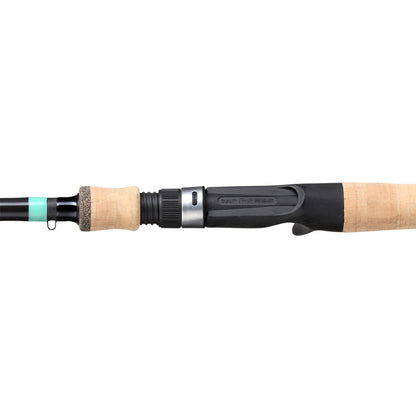 Close-up of the G. Loomis GCX Inshore Casting Rod 842C MF 7'0" Medium handle, showing its cork grip and black reel seat with metal ring, set against a white background.