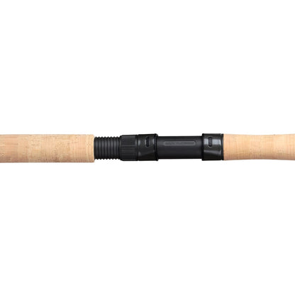 A close-up of the G. Loomis GCX Inshore Spinning Rod 842S MGM 7'0" Medium Mag Moderate handle with cork grip and Fuji reel seat by G. Loomis, displayed against a white background.