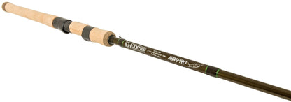 A close-up of the G. Loomis IMX-PRO Ned Rig 882S NRR 7'4" Medium Spinning Rod (12904-01) shows its cork handle and black reel seat, with G. Loomis branding on the dark shaft—perfect for Ned Rig techniques.