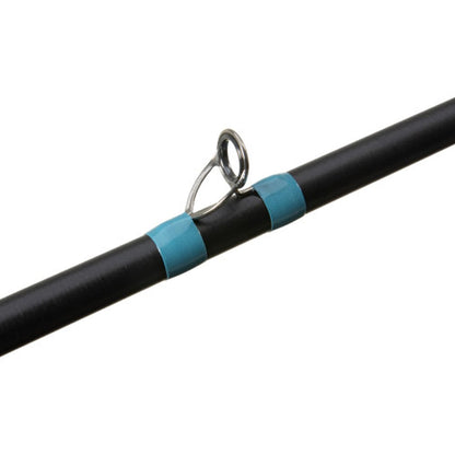 Close-up of a black G. Loomis NRX+ Jig & Worm Casting Rod 854C JWR 7'1" Heavy with a silver guide ring, secured by two blue wrappings.