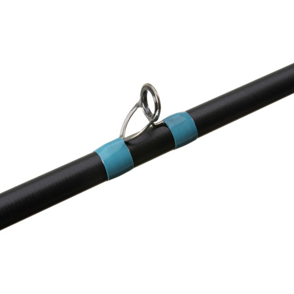 The black G. Loomis NRX+ Mag Bass Casting Rod 843C MBR 7'0" Medium Heavy by americanlegacyfishing features silver eyelet guides, crafted with Spiral X technology and wrapped in turquoise thread near the eyelets, echoing its precise construction and design elements.