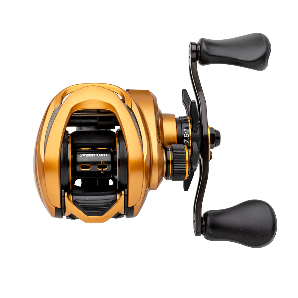 Lew's Custom Pro Gen 3 Casting Reel 7.5:1 RH (CPB1SHG3) in gold and black, with dual black handles and adjustment dials, featuring advanced Inertia Transfer Braking, shown against a white background.