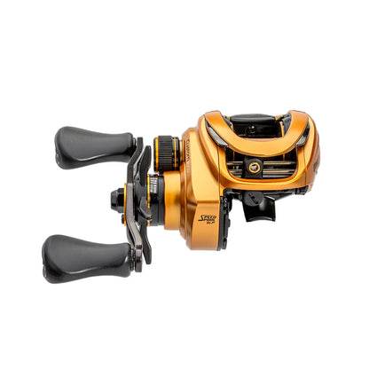 A Lew's Custom Pro Gen 3 Casting Reel 7.5:1 RH (CPB1SHG3) in gold and black, featuring two black handles, is shown from the side against a white background.