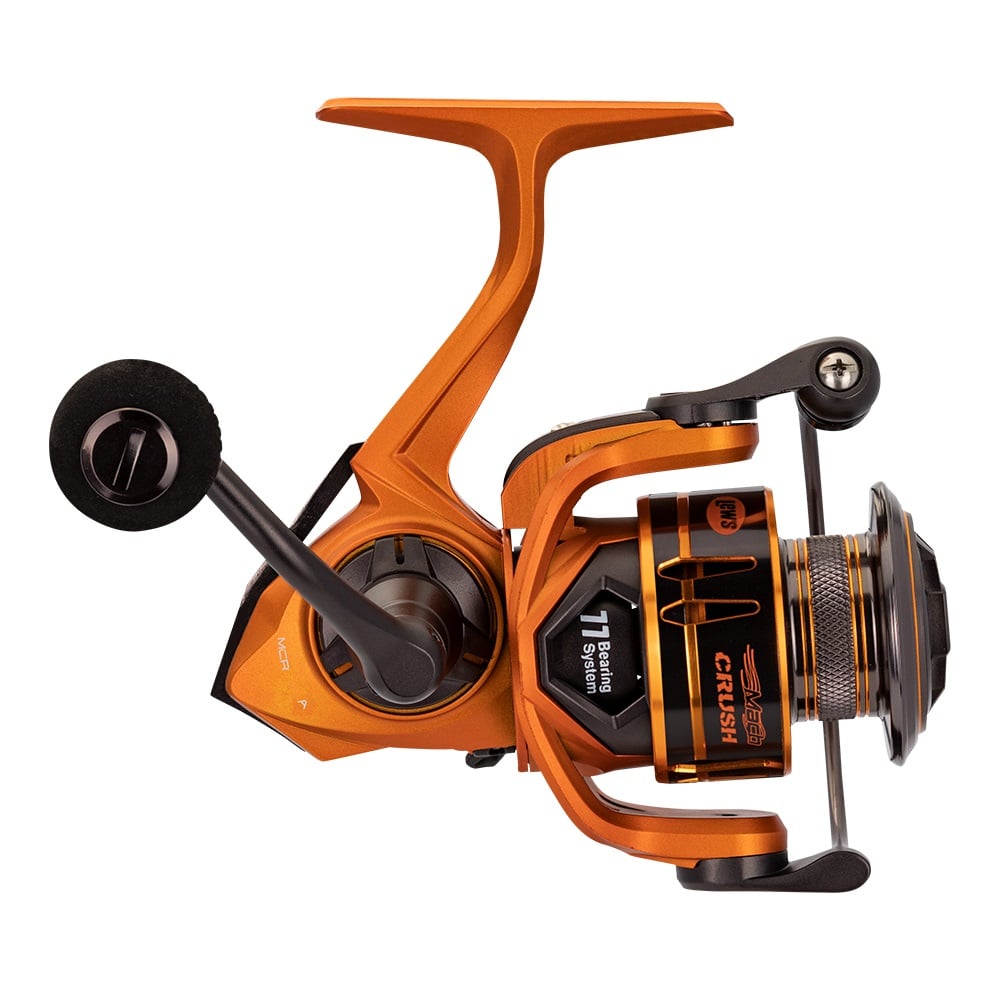 Lew's Mach Crush Spinning Series Reel (MCR400A) features a 6.2:1 gear ratio, left-side handle, visible gears, “CRUSH” spool label, and a modern orange and black metallic design in this side profile view.