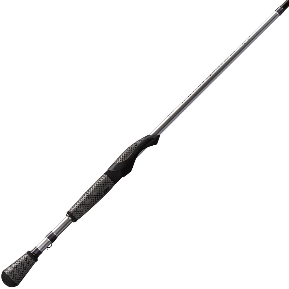 The Lew's Team Signature Series 7'0" Medium Spinning Rod (TLS70MXFS) features a black and silver handle with textured grips, a metallic shaft, and FOCAS Blank technology for superior performance.