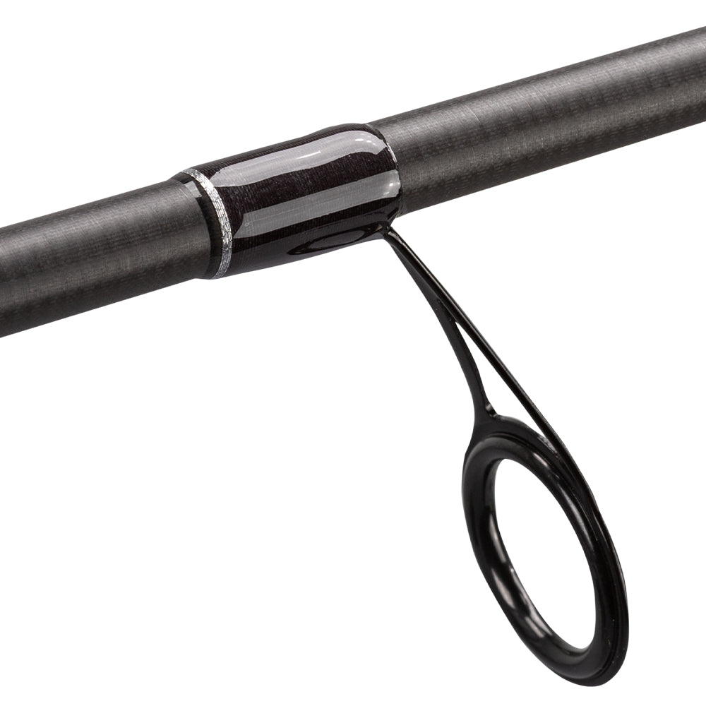 Close-up of a Lew's Team Lew's Signature Series Spinning Rod 7'2" Medium (TLS72MXFS) guide, showcasing the circular loop, FOCAS Blank technology, and a textured surface with glossy black thread wraps.